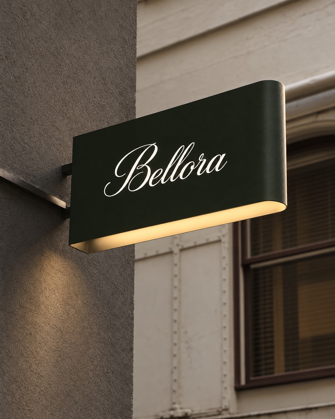 Curved illuminated blade sign mounted to a building facade.