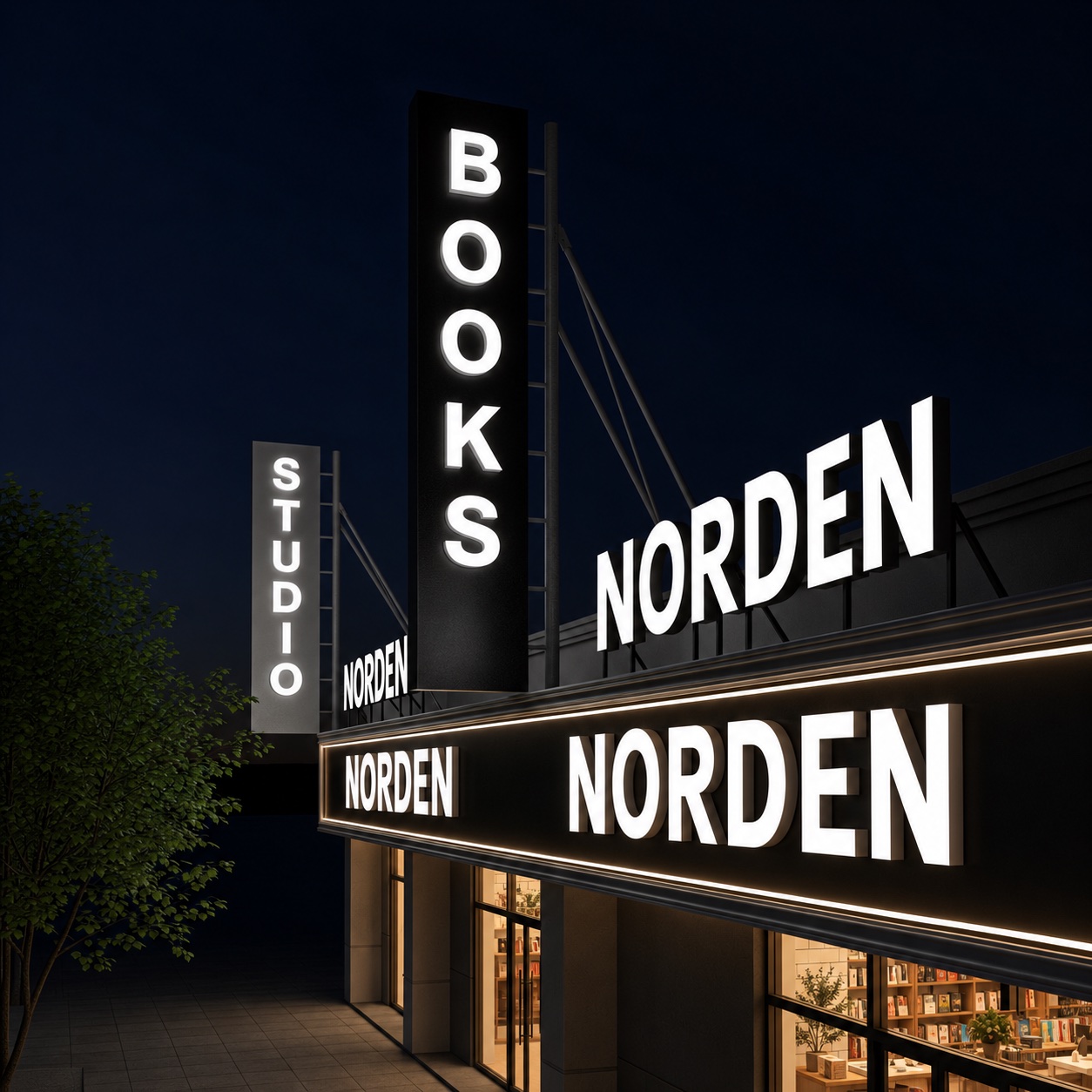 Multi-format illuminated signage across a bookstore exterior at night.